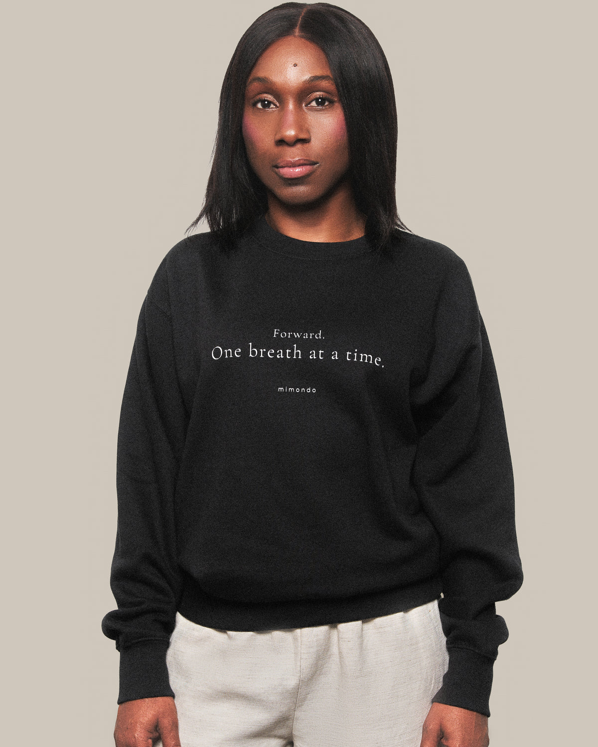 The Persist Sweatshirt in Black. The print reads: Forward. One breath at a time.